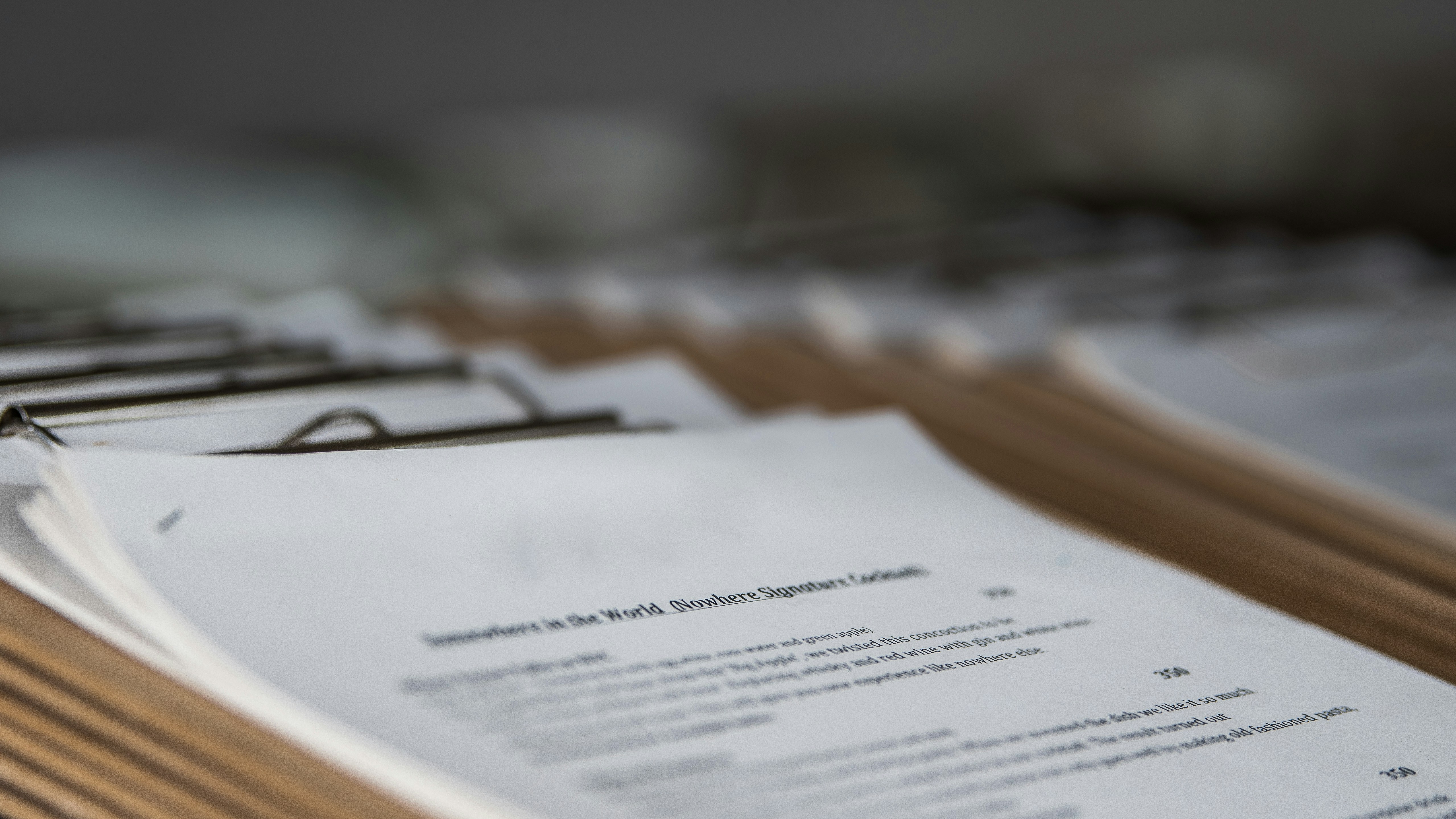 Bound estate planning binders stacked on a desk